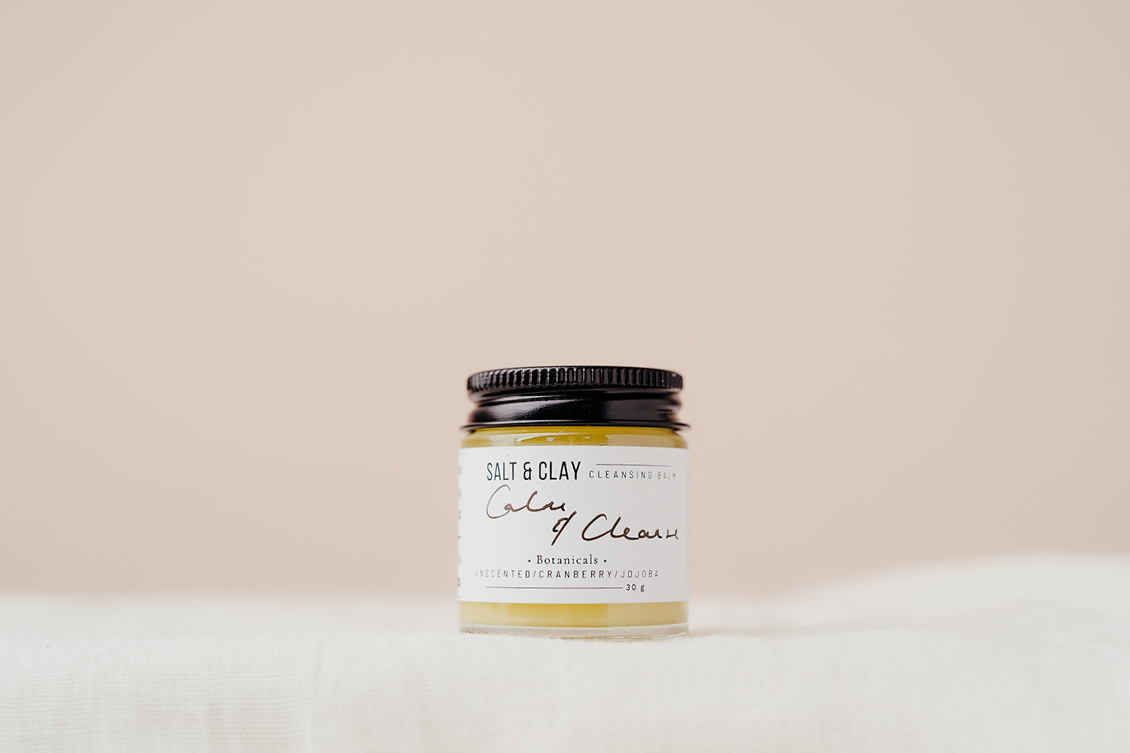 Our best selling Calm and Cleanse cleansing balm featuring nourishing and soothing butters and oils. Unscented. Plant based beauty. Vegan skincare. Vegan beauty. Salt & Clay. 