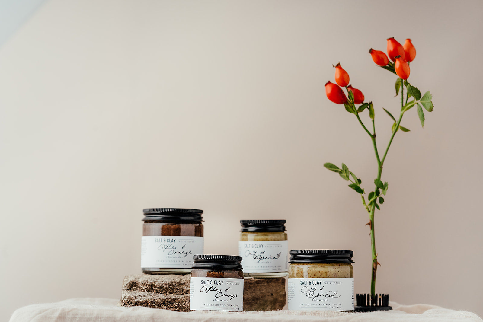 Coffee and orange face scrub made by Salt & Clay. Packaged in a recycled glass jar with a recyclable aluminium lid. Vegan friendly skincare.  