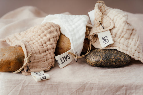 Organic cotton face cloths in three colours. Natural (white), Espresso and Earl Grey. Made from multiple layers of cotton muslin. Face cloth. Hand dyed with natural fruit and vegetable dyes. Vegan skincare. Salt & Clay. Hampshire UK.