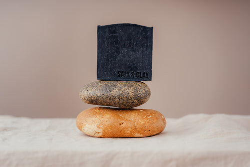 A luxury black charcoal soap made by Salt and Clay. It is hand stamped with our logo Salt & Clay. Packaged in recycled paper packaging and hand sewn. All of our soaps are Vegan friendly and cruelty free. Made in small batched in Hampshire, England.